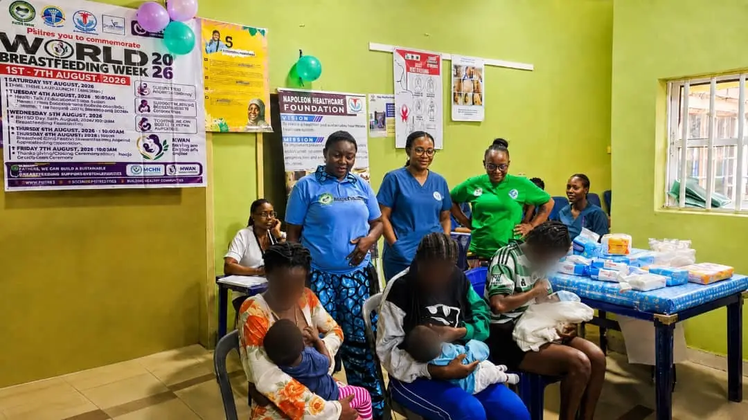Breastfeeding demonstration session on positioning and attachment (faces softened for privacy)