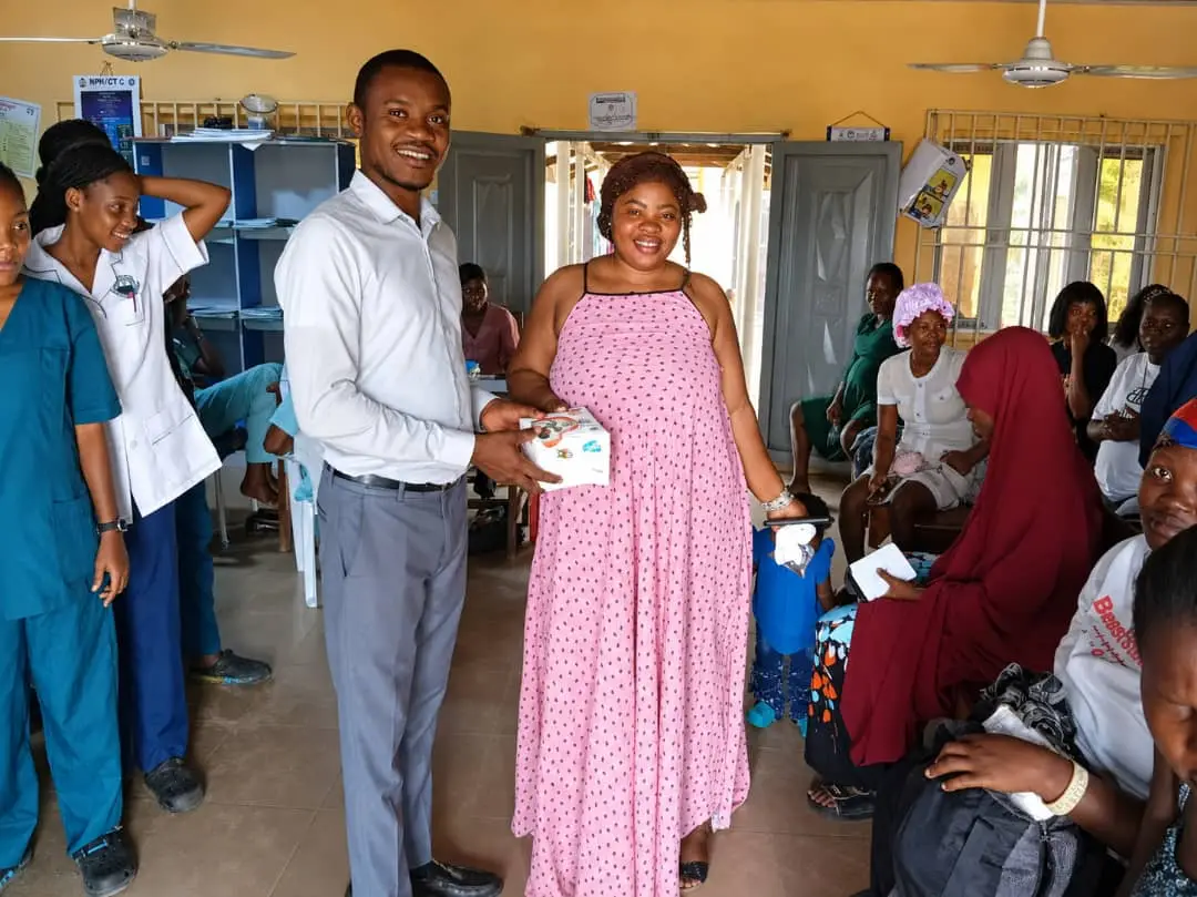 Infant care items being distributed to a mother during World Breastfeeding Week 2026